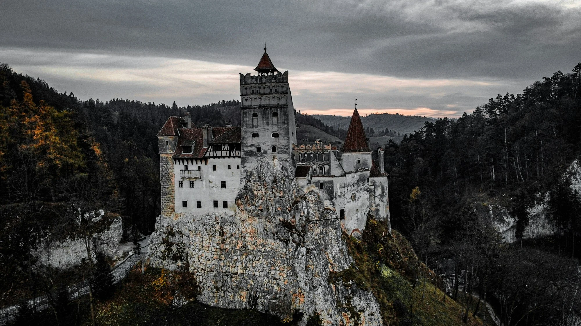 Bran Castle above the wooded hills of Transylvania