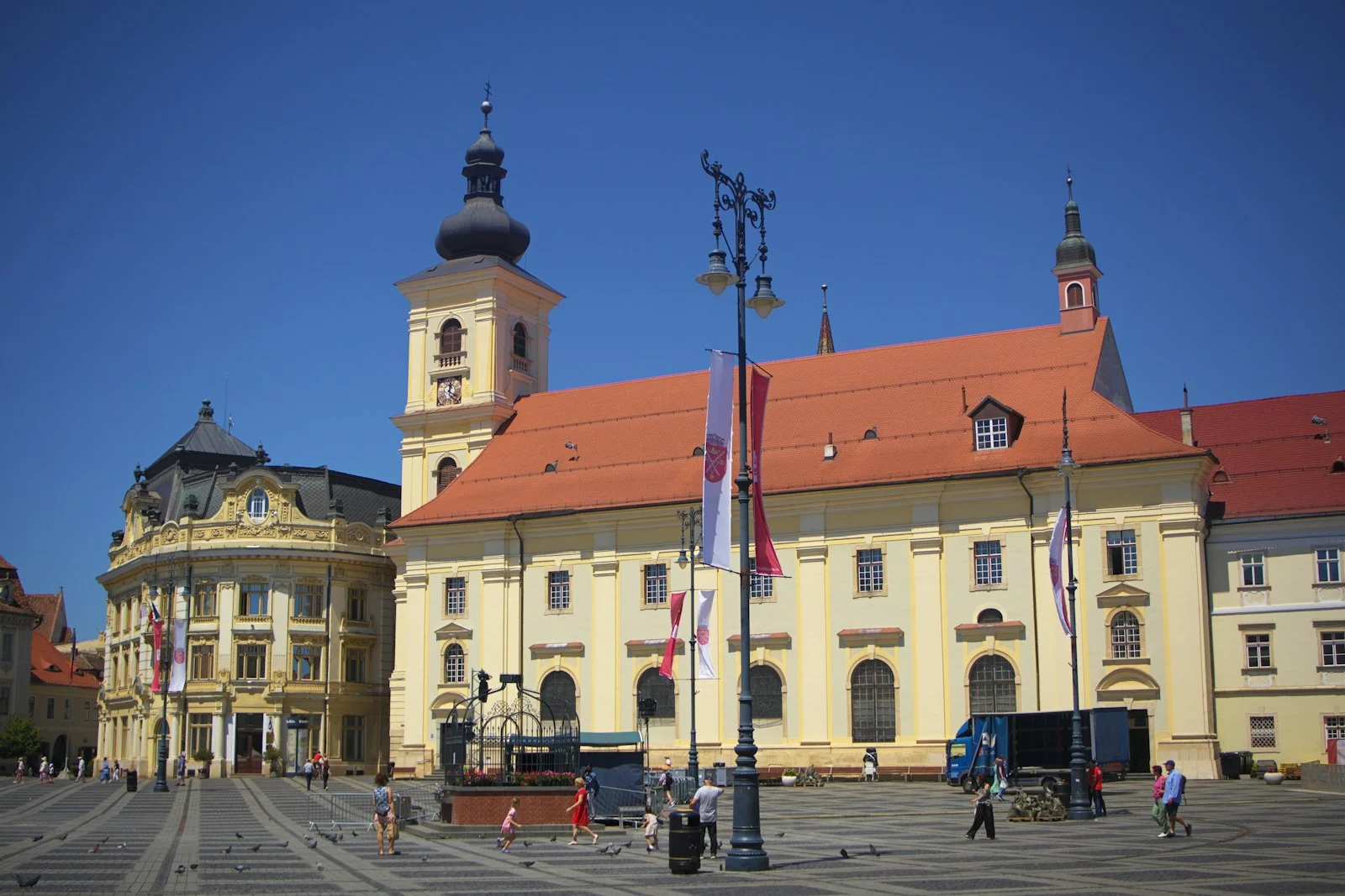 Historic buildings and the yellow church on a central square in Sibiu